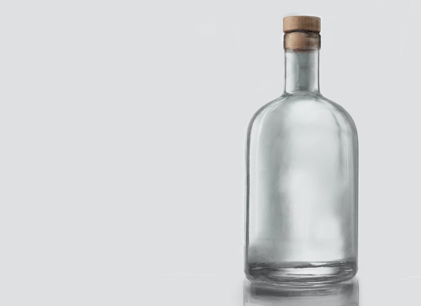 clear glass bottle with white background